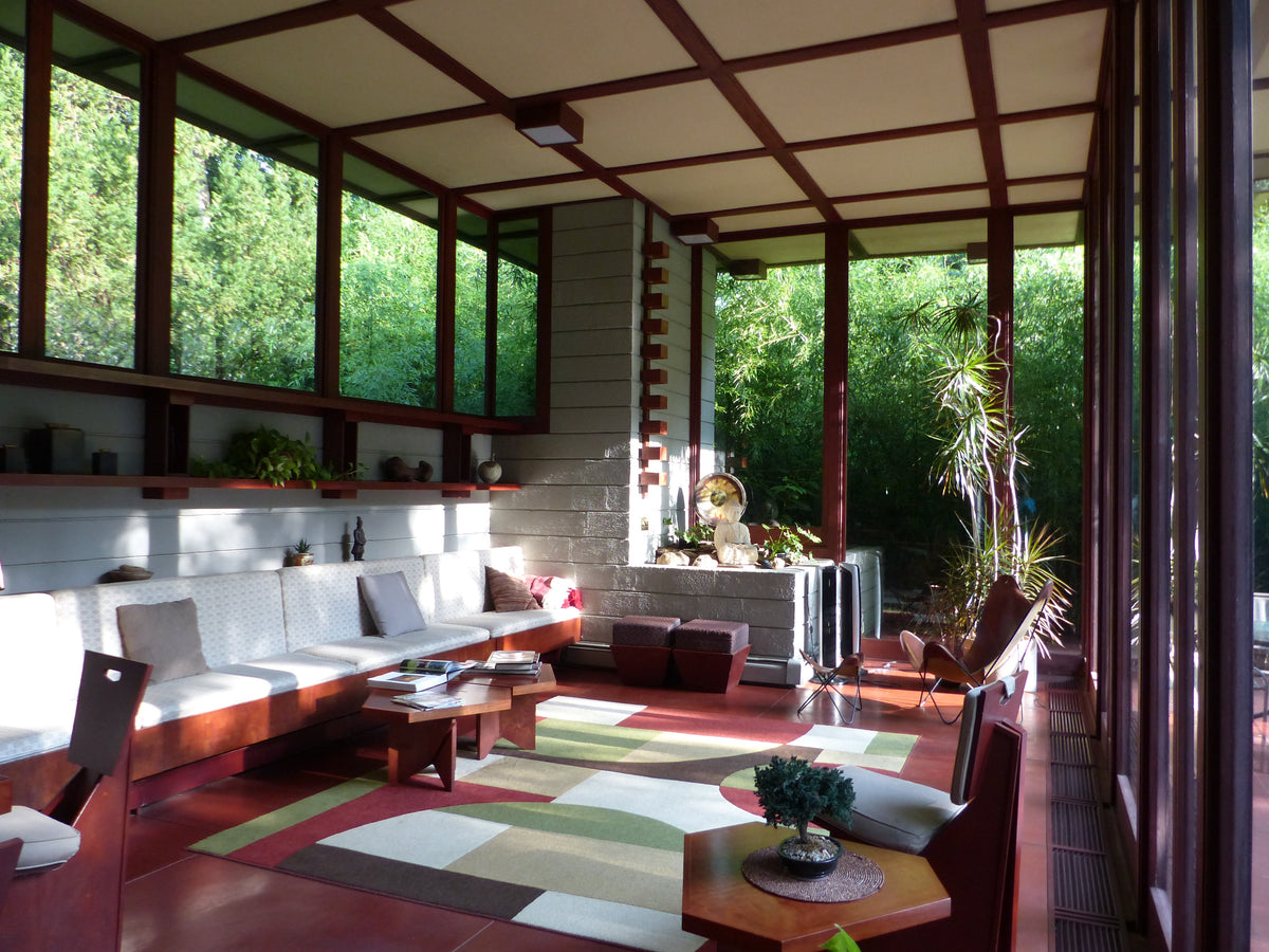 The living room of Frank Lloyd Wright's 1955 Louis Penfield House, with a long low built-in sofa